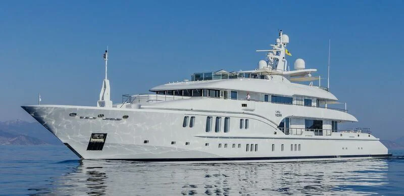 a large white ship in the water aboard LADY VERA Yacht for Sale