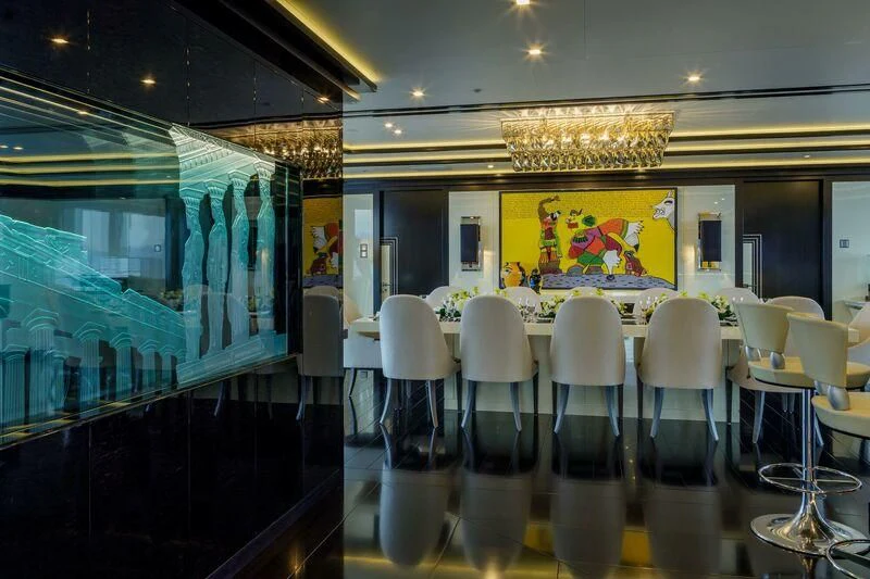 a room with chairs and tables aboard LADY VERA Yacht for Sale