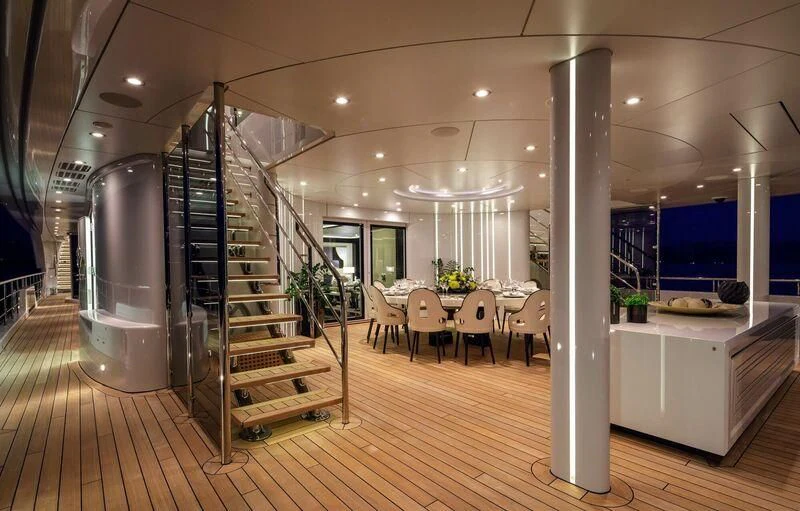 a room with a staircase and a glass wall aboard LADY VERA Yacht for Sale