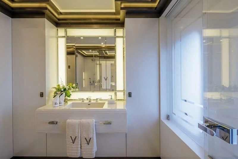 a bathroom with a large mirror aboard LADY VERA Yacht for Sale