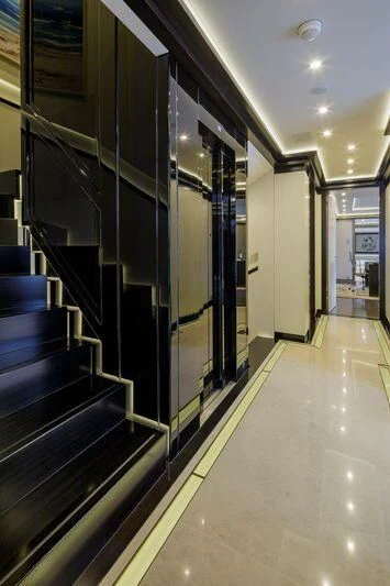 a hallway with glass doors aboard LADY VERA Yacht for Sale