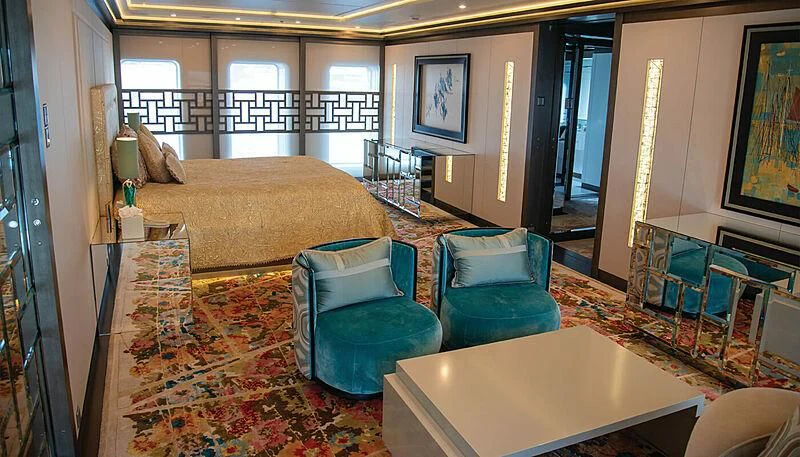 a large bedroom with a balcony aboard LADY VERA Yacht for Sale