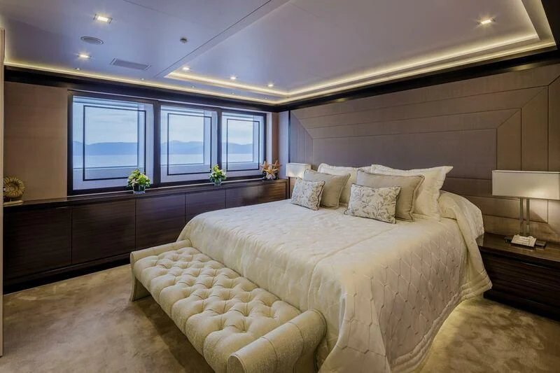 a large bedroom with a large bed aboard LADY VERA Yacht for Sale