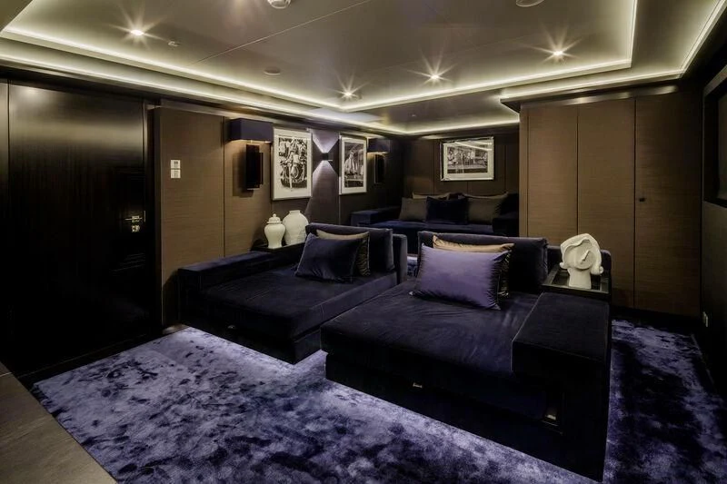 a room with a bed and a dresser aboard LADY VERA Yacht for Sale