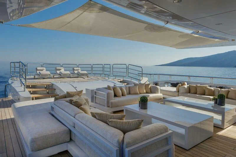 a living room with a large balcony aboard LADY VERA Yacht for Sale