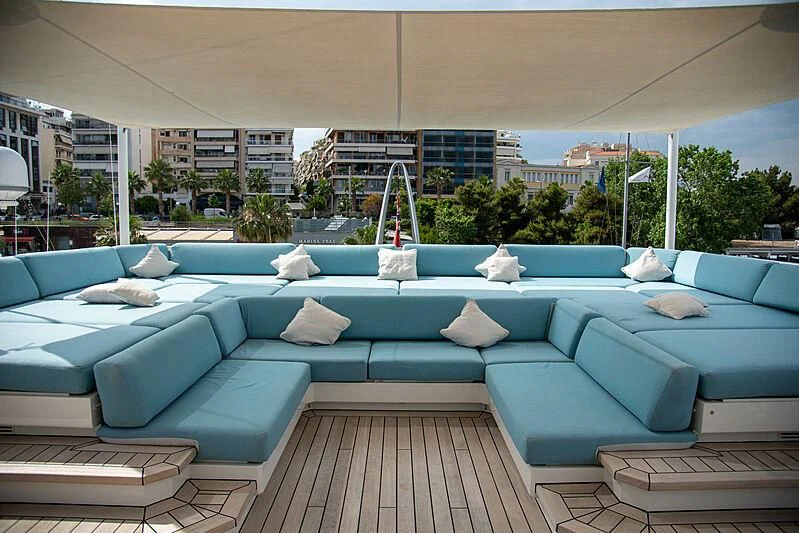 a pool with lounge chairs and pillows aboard LADY VERA Yacht for Sale