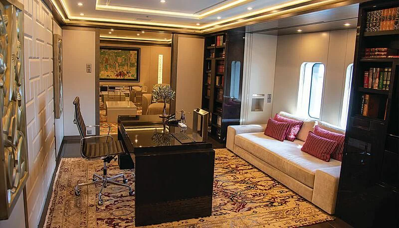 a living room with a couch and a coffee table aboard LADY VERA Yacht for Sale