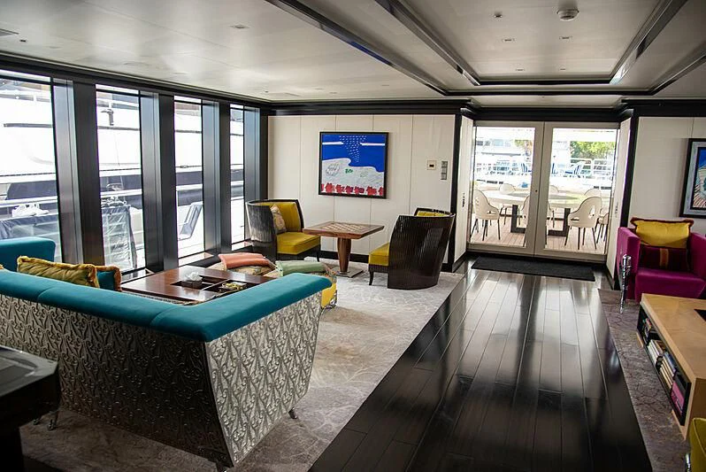 a living room with a large window aboard LADY VERA Yacht for Sale