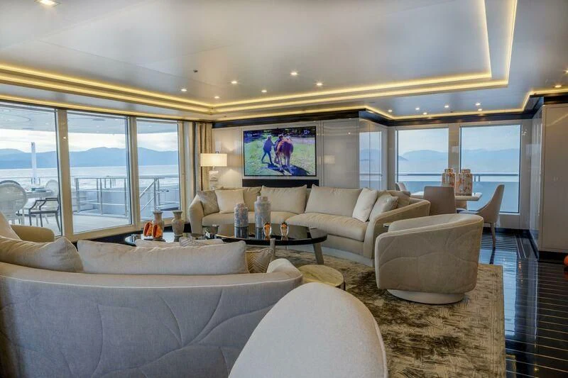 a living room with a large window aboard LADY VERA Yacht for Sale