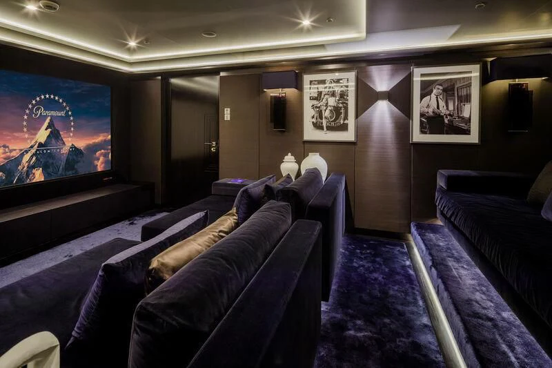 a large room with couches and a television aboard LADY VERA Yacht for Sale