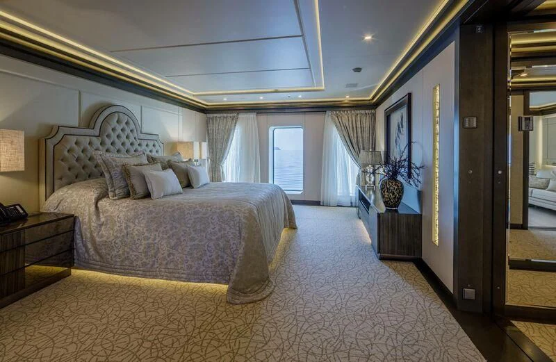 a large bedroom with a large bed aboard LADY VERA Yacht for Sale