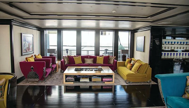 a living room with a couch and a table aboard LADY VERA Yacht for Sale