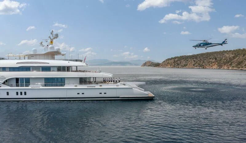 a helicopter flying over a boat aboard LADY VERA Yacht for Sale