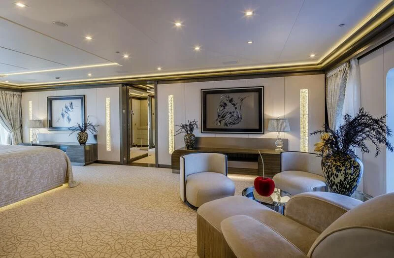 a living room with a large screen aboard LADY VERA Yacht for Sale