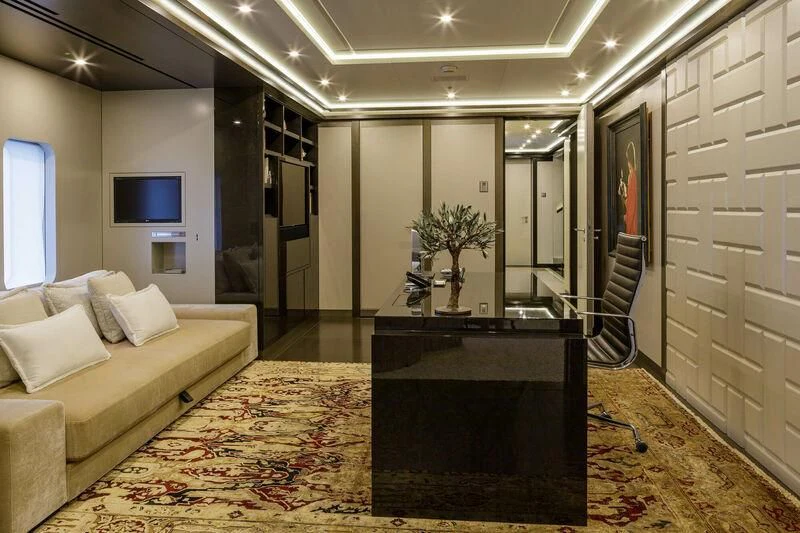 a living room with a couch and a coffee table aboard LADY VERA Yacht for Sale