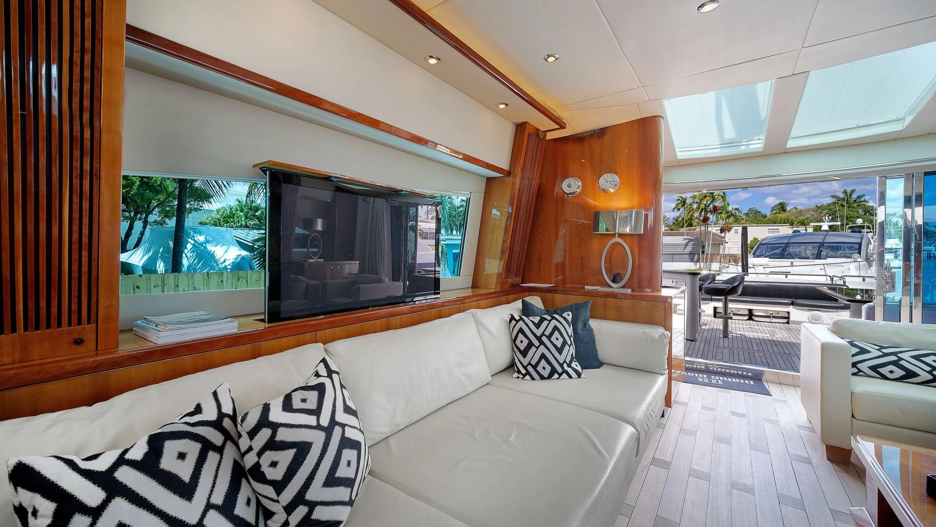 a living room with a large window aboard DIABLO BLANCO Yacht for Sale