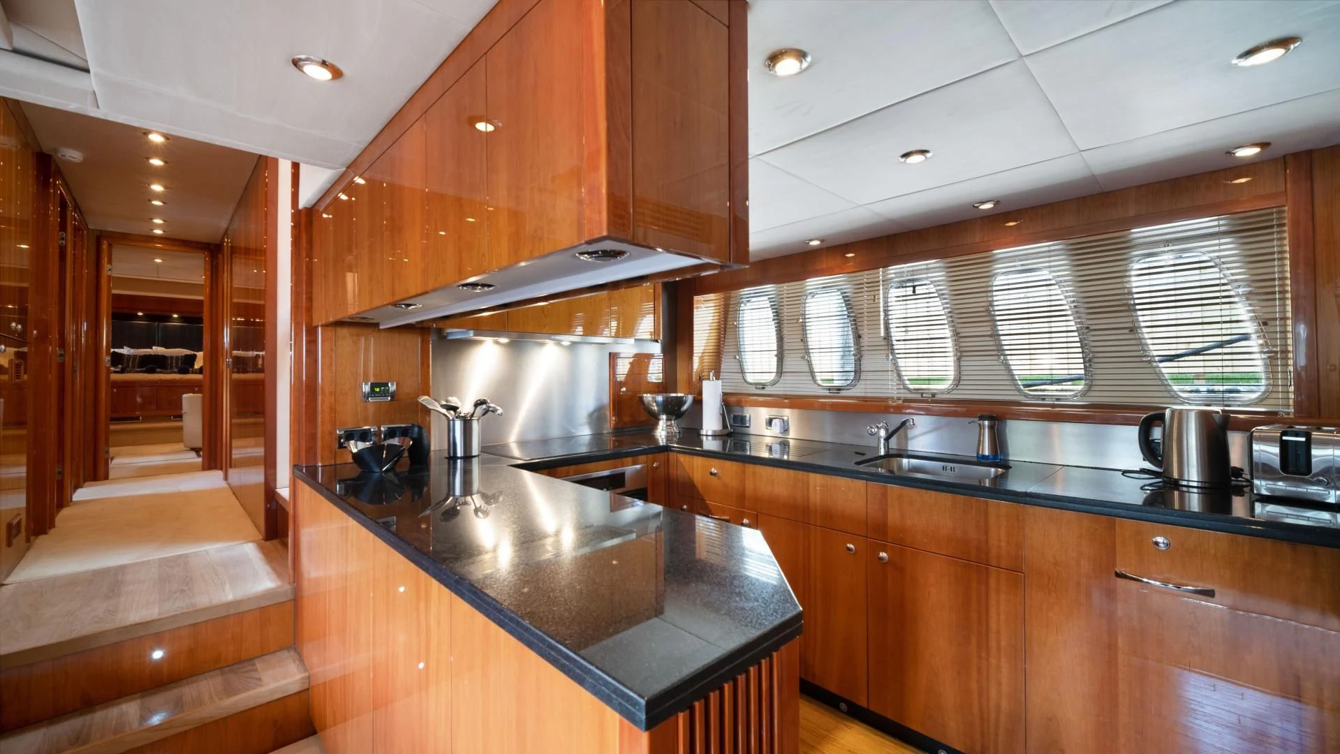 a kitchen with a large island aboard DIABLO BLANCO Yacht for Sale
