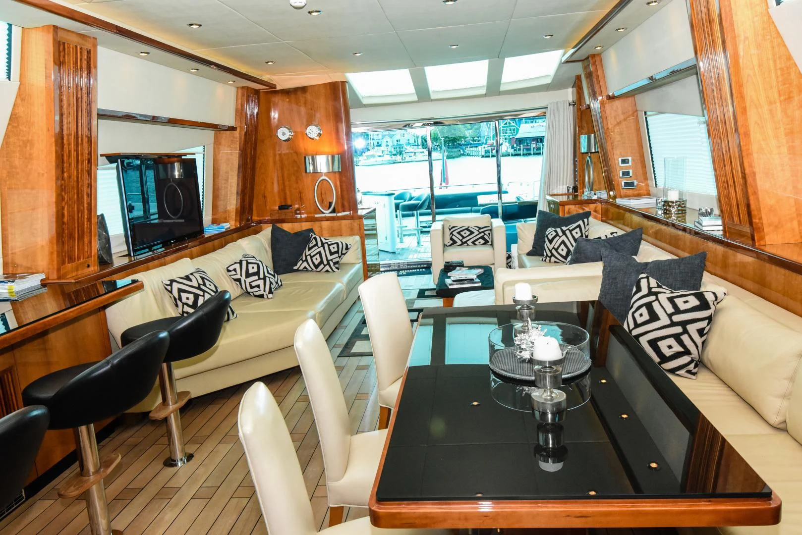 a living room with a table and chairs aboard DIABLO BLANCO Yacht for Sale