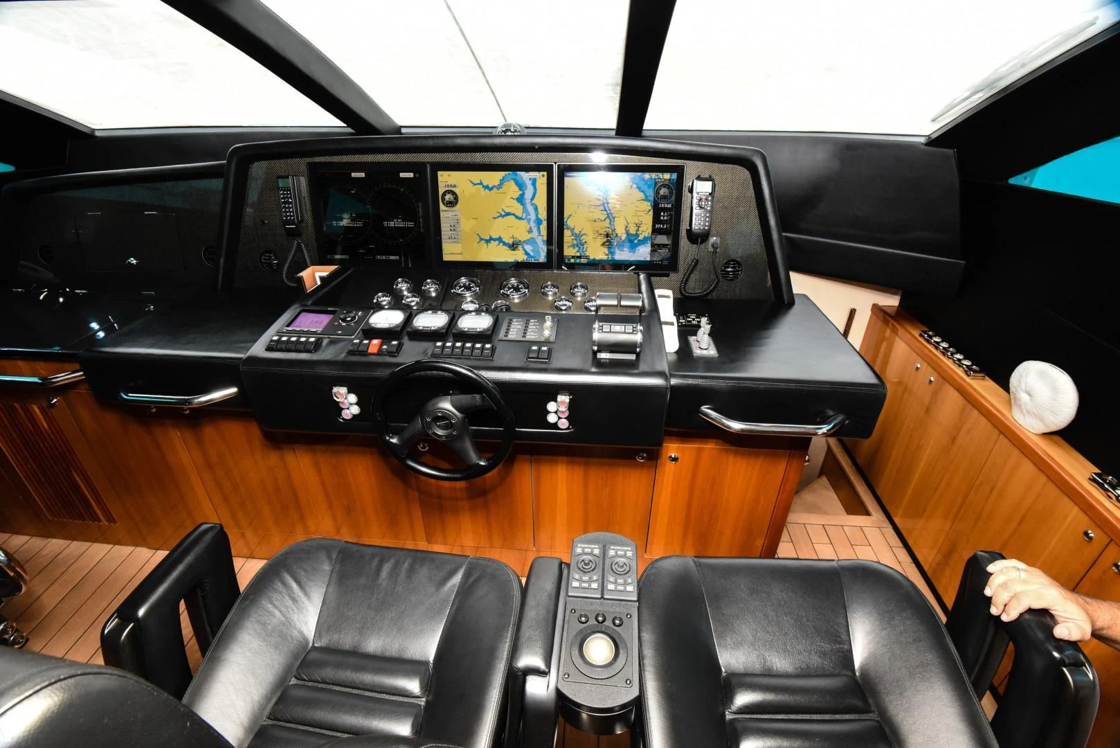 a black console with a controller on it aboard DIABLO BLANCO Yacht for Sale
