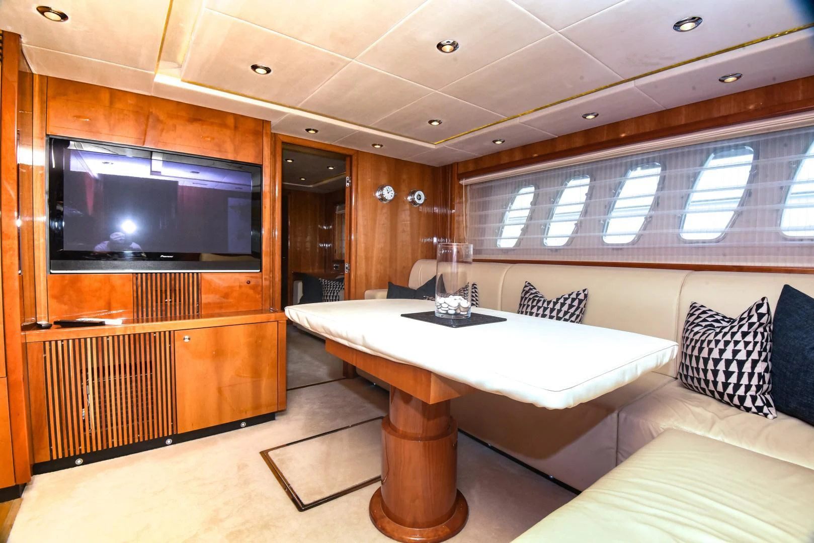 a room with a table and a tv aboard DIABLO BLANCO Yacht for Sale