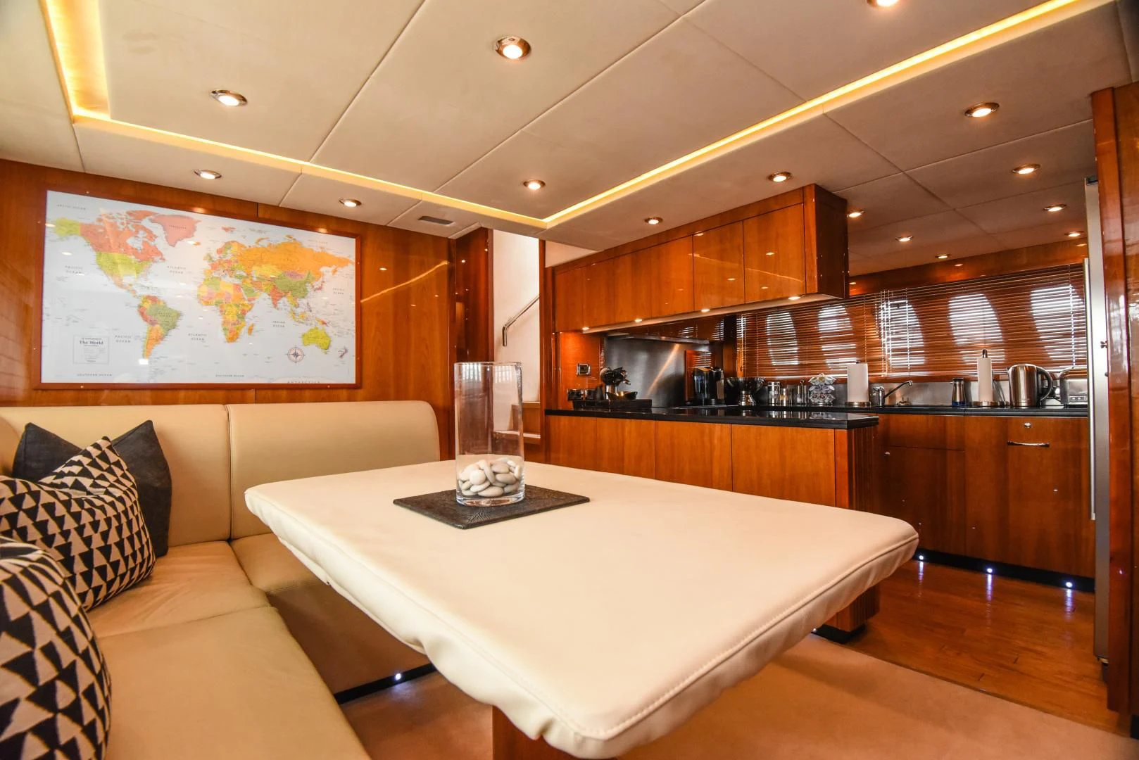 a large kitchen with a large white table and a large white table aboard DIABLO BLANCO Yacht for Sale