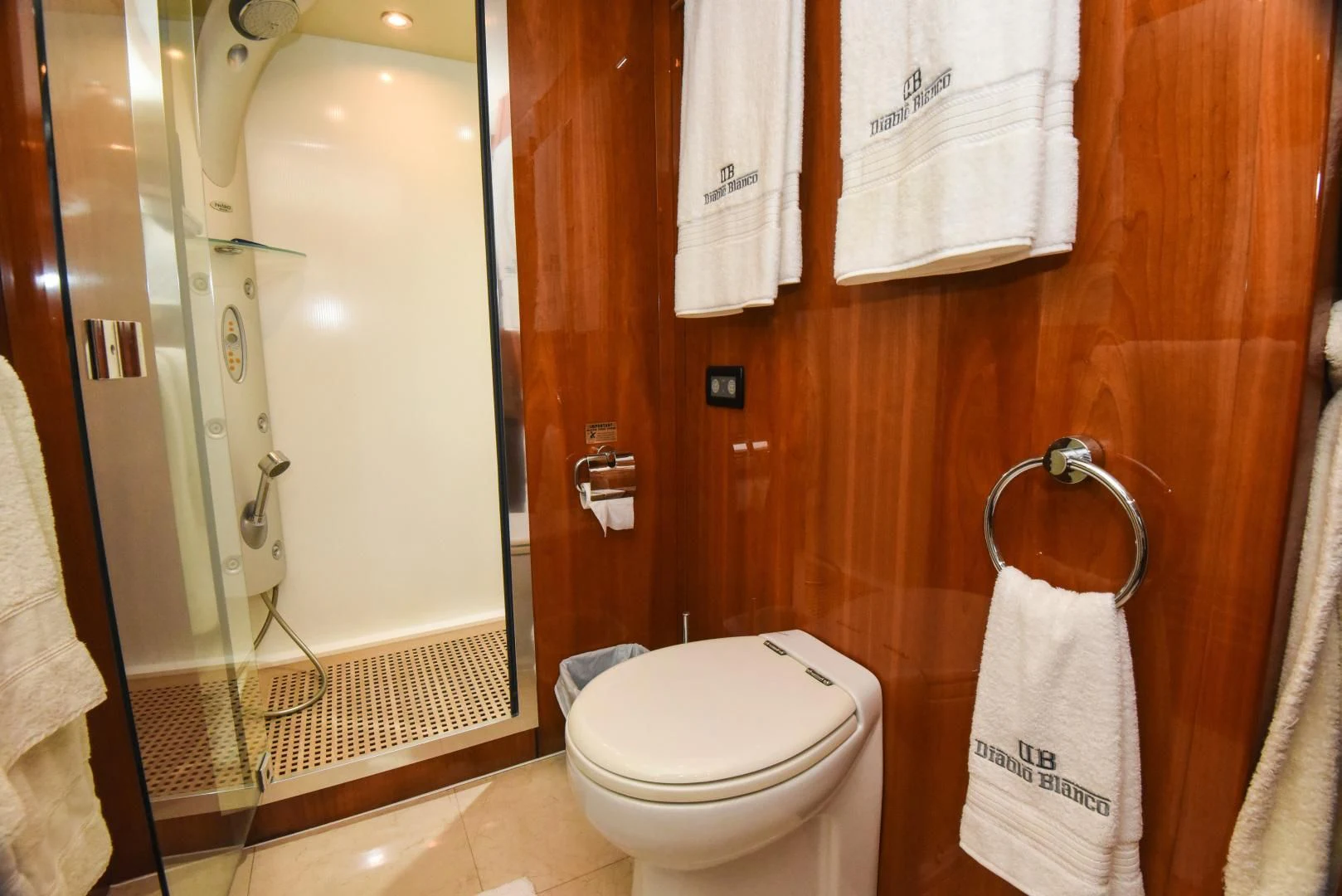 a bathroom with a toilet and a mirror aboard DIABLO BLANCO Yacht for Sale