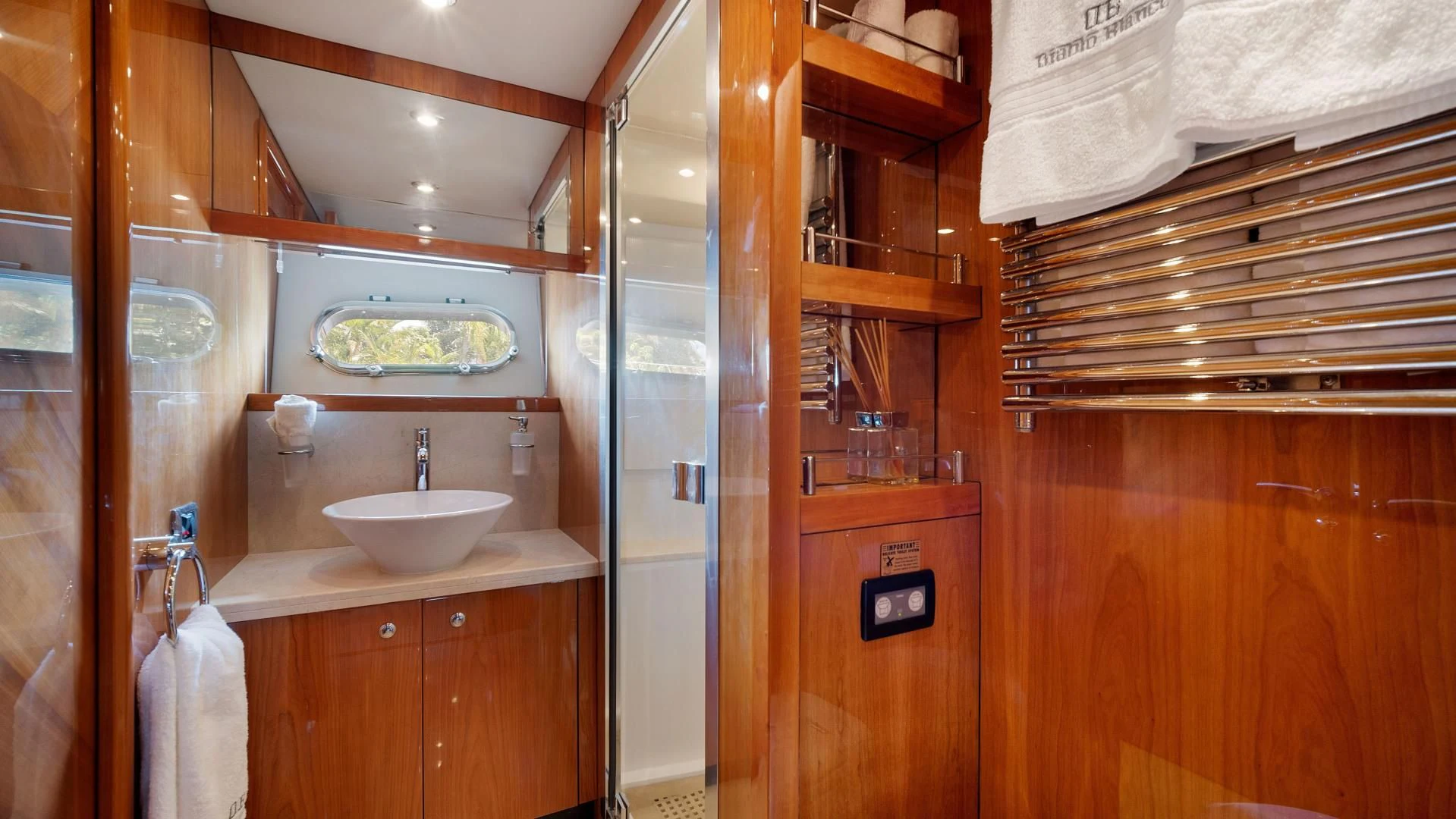 a bathroom with wooden cabinets aboard DIABLO BLANCO Yacht for Sale