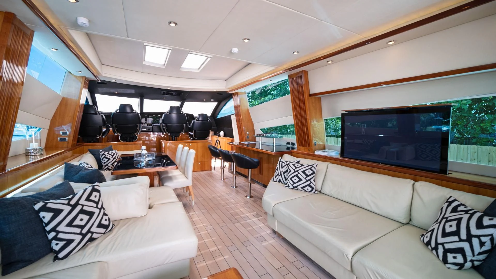 a living room with a couch and a tv aboard DIABLO BLANCO Yacht for Sale
