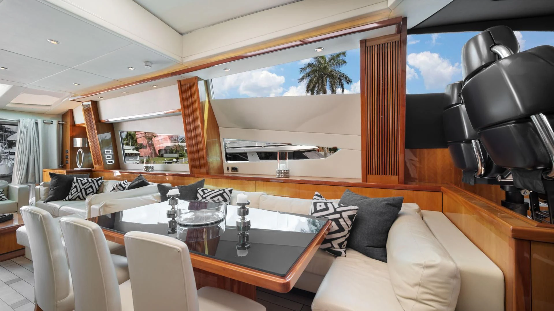 a room with a table chairs and a large window aboard DIABLO BLANCO Yacht for Sale