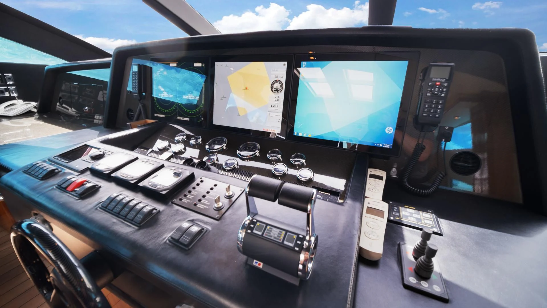 a desk with many computers and electronics on it aboard DIABLO BLANCO Yacht for Sale