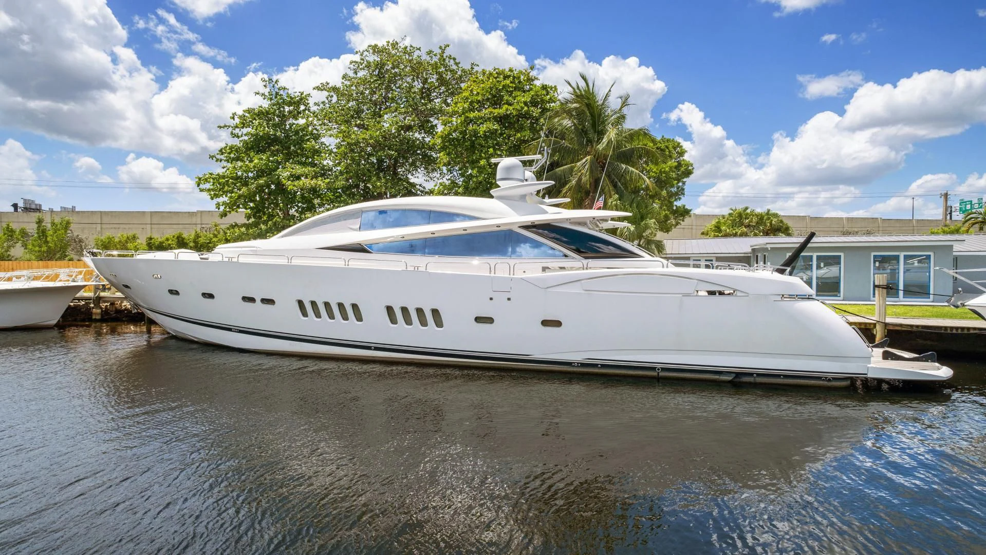 a white yacht docked at a dock aboard DIABLO BLANCO Yacht for Sale