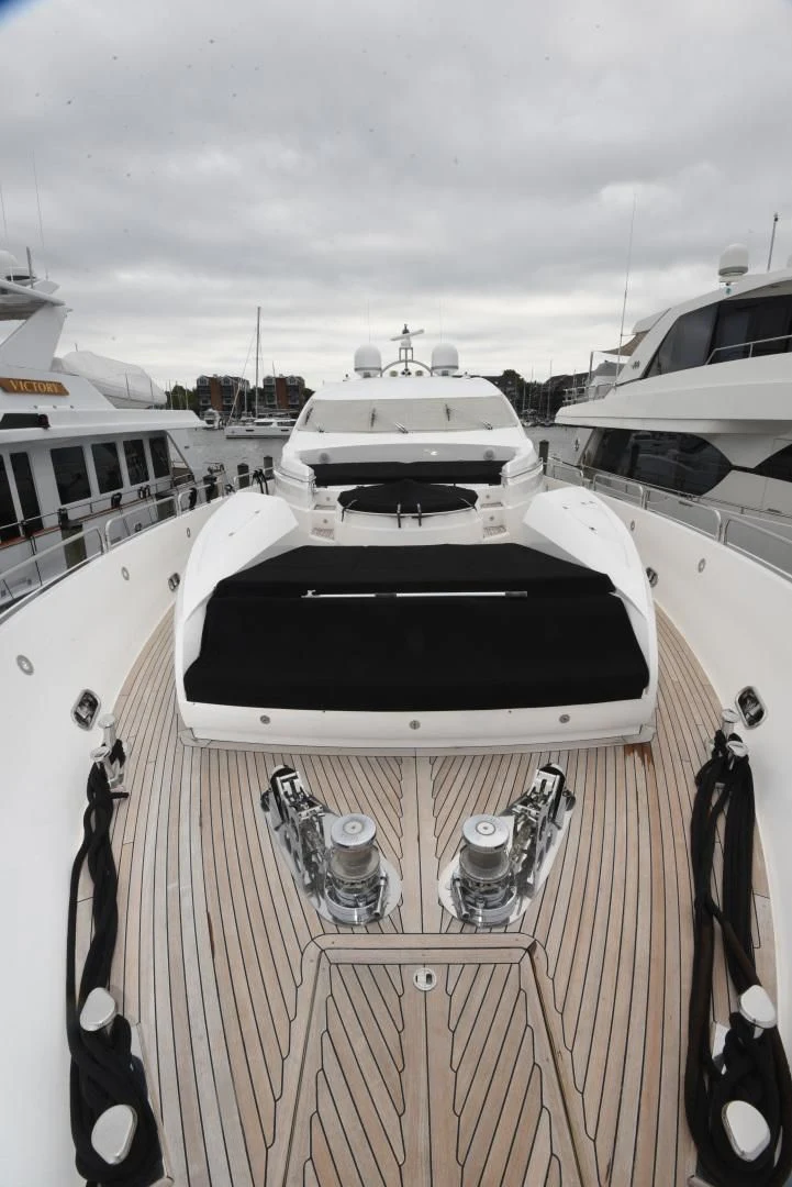 a white car with a door open on a boat in the water aboard DIABLO BLANCO Yacht for Sale