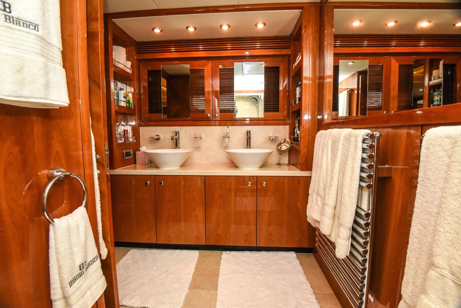 a bathroom with a sink and a mirror aboard DIABLO BLANCO Yacht for Sale
