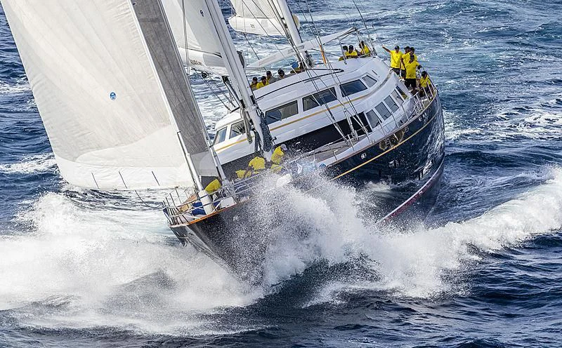 a boat with a large body of water and a group of people on it aboard THE AQUARIUS Yacht for Sale