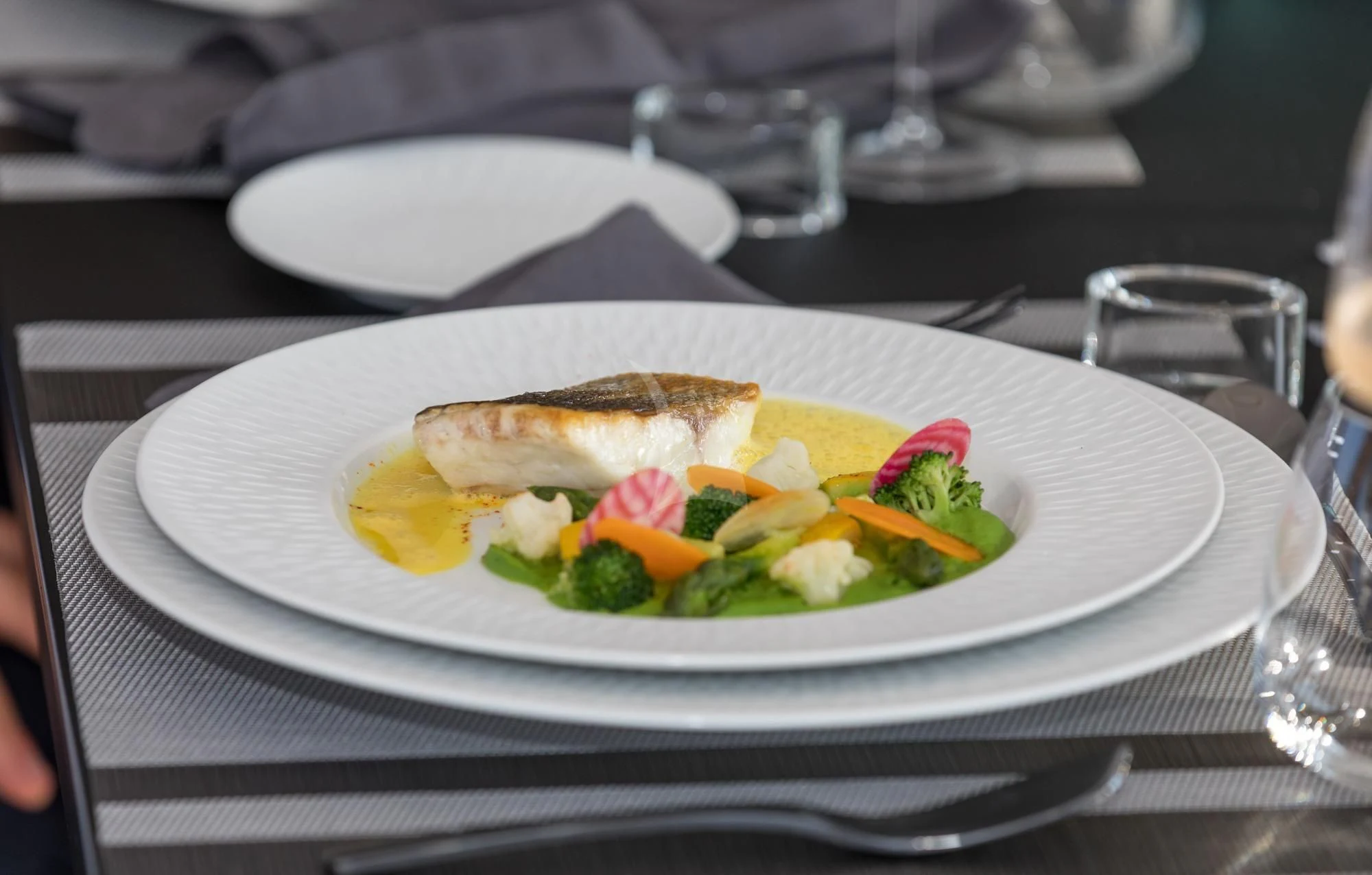 a plate of food aboard NEWAL Yacht for Sale