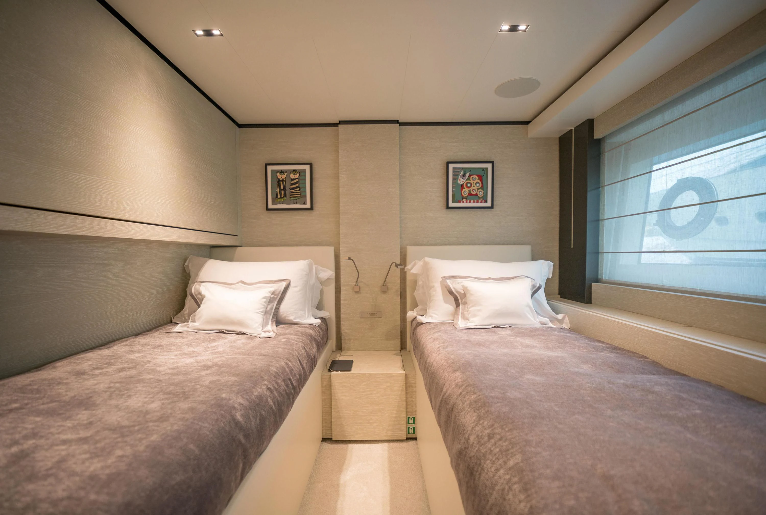 a couple of beds in a hotel room aboard NEWAL Yacht for Sale