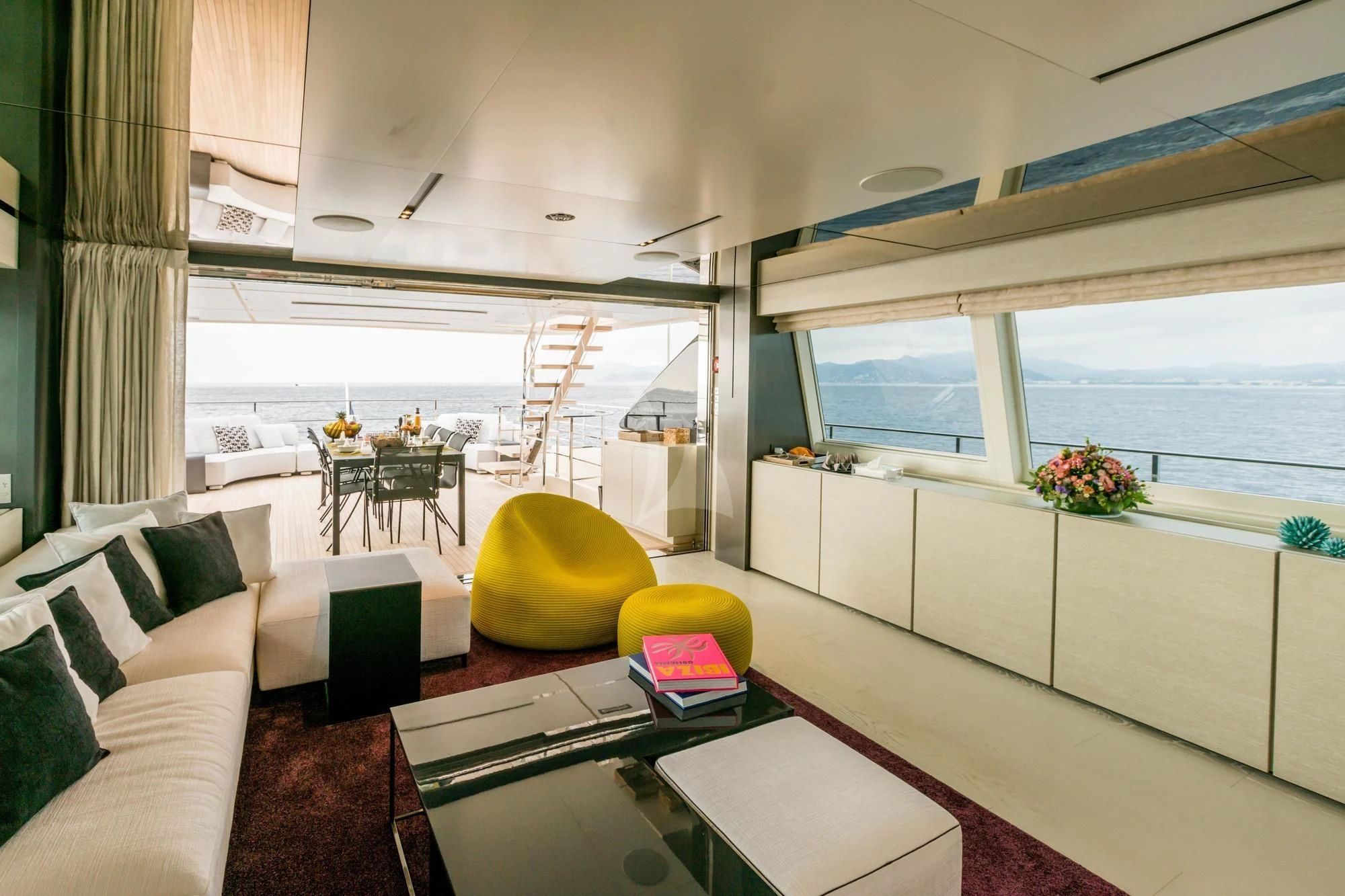 a living room with a large window aboard NEWAL Yacht for Sale