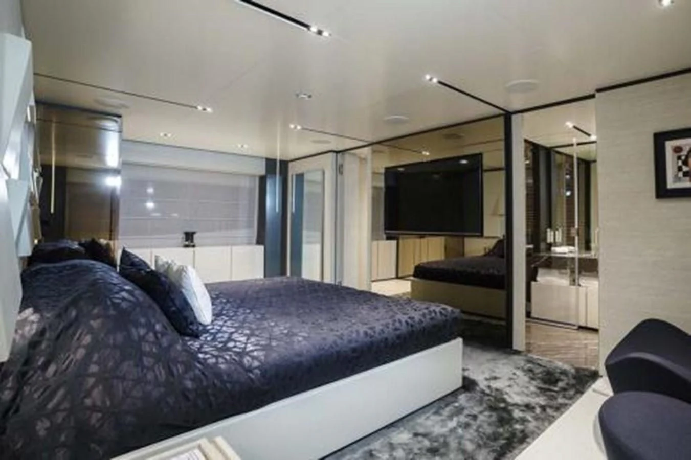 a bedroom with a large bed aboard NEWAL Yacht for Sale