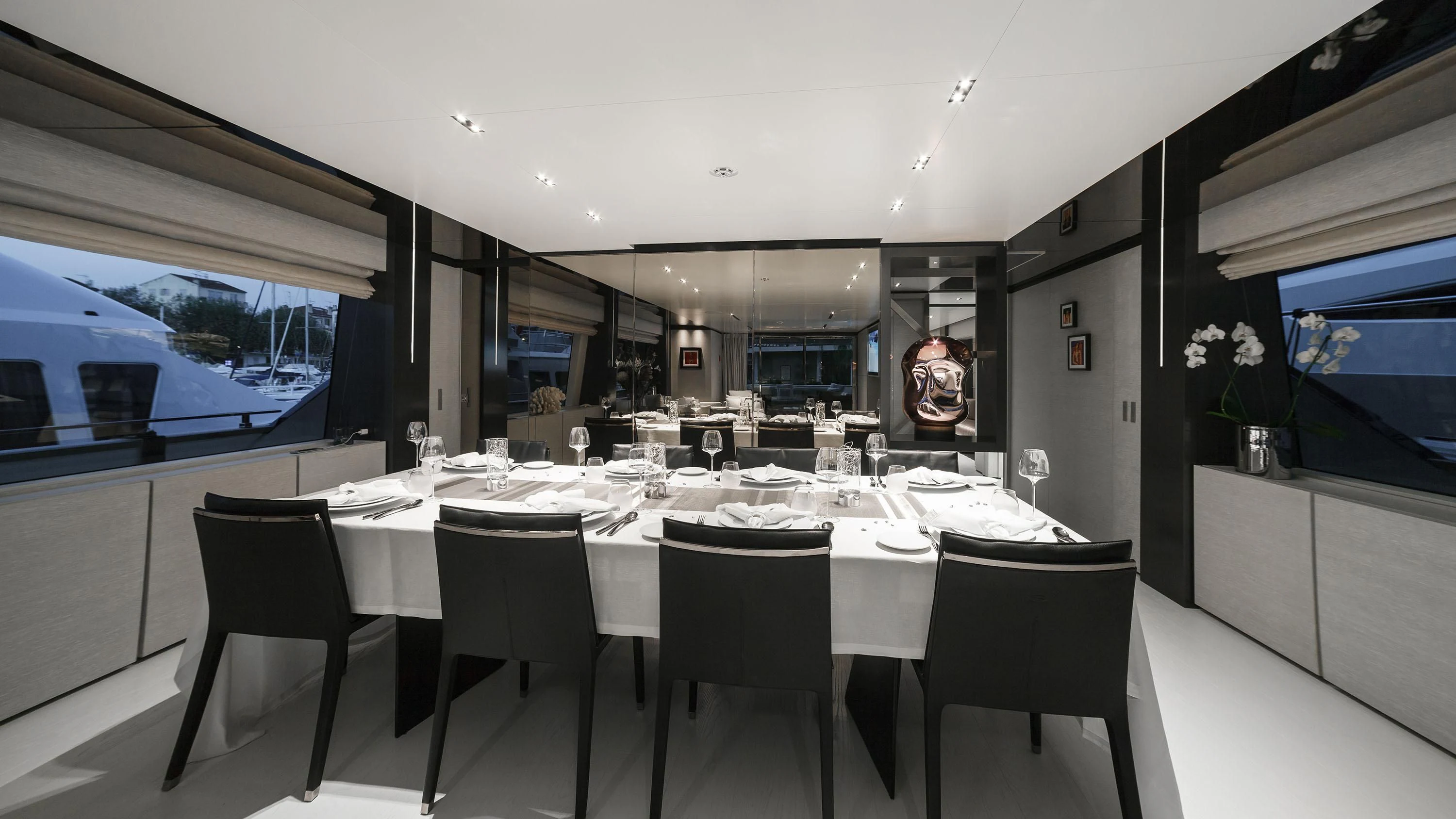 a dining room with a table and chairs aboard NEWAL Yacht for Sale