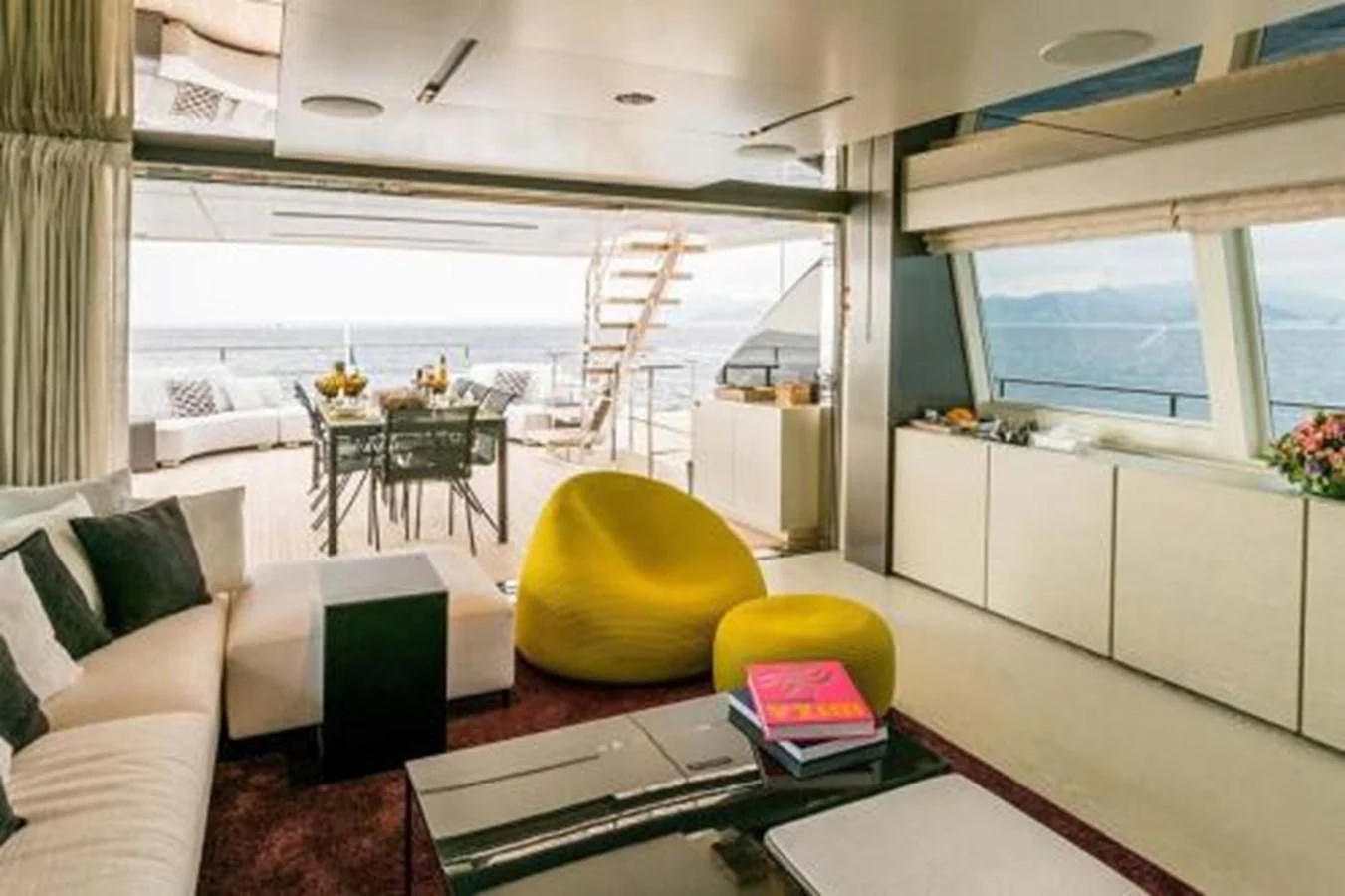 a living room with a couch and a television aboard NEWAL Yacht for Sale