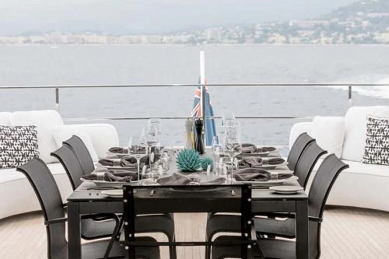 a table with a glass vase on it aboard NEWAL Yacht for Sale