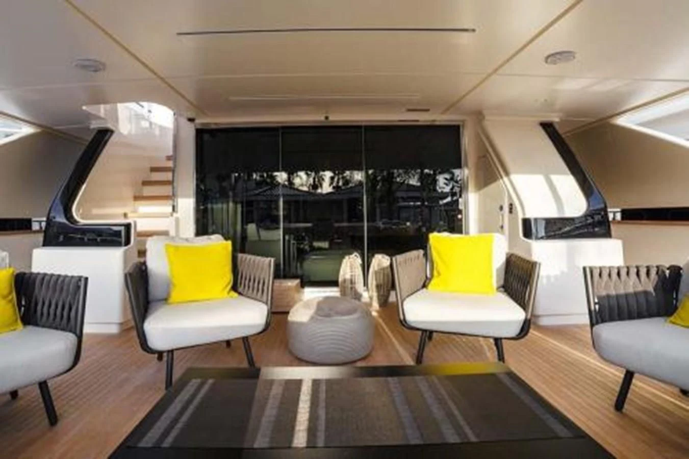a room with chairs and a table aboard NEWAL Yacht for Sale