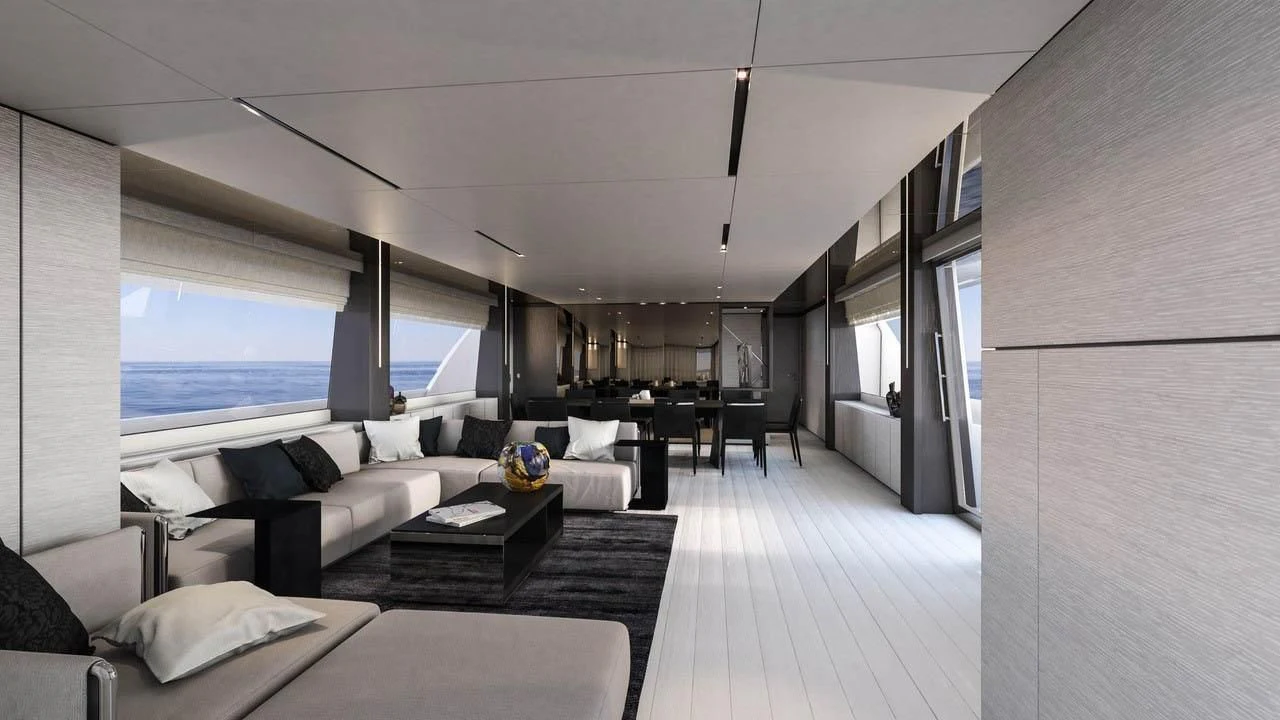 a room with a couch and a table and a large window aboard NEWAL Yacht for Sale