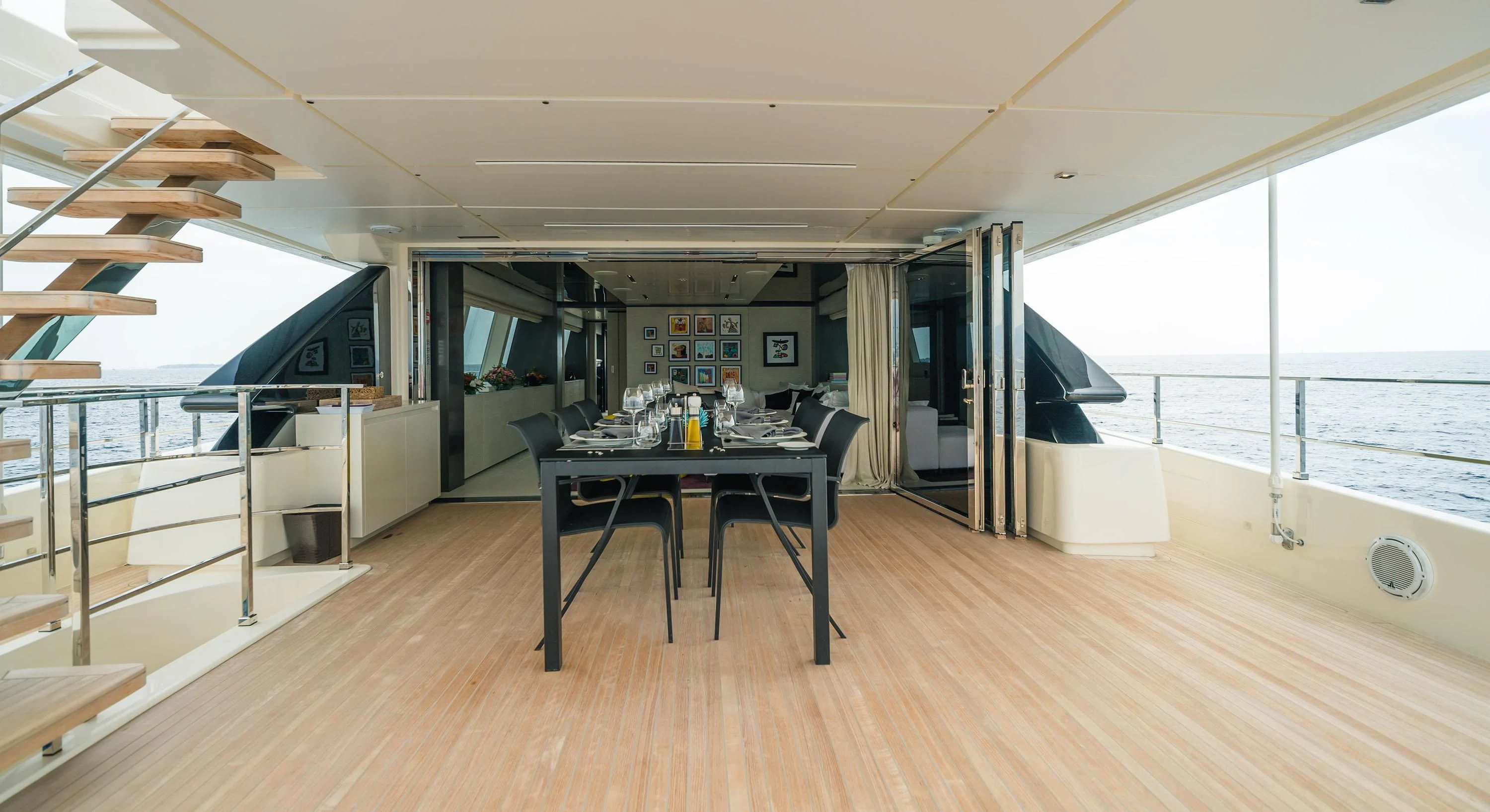 a room with a table and chairs aboard NEWAL Yacht for Sale