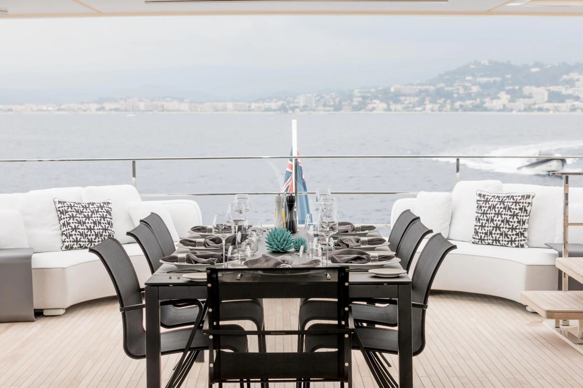 a table with a cloth draped over it and a view of the water aboard NEWAL Yacht for Sale