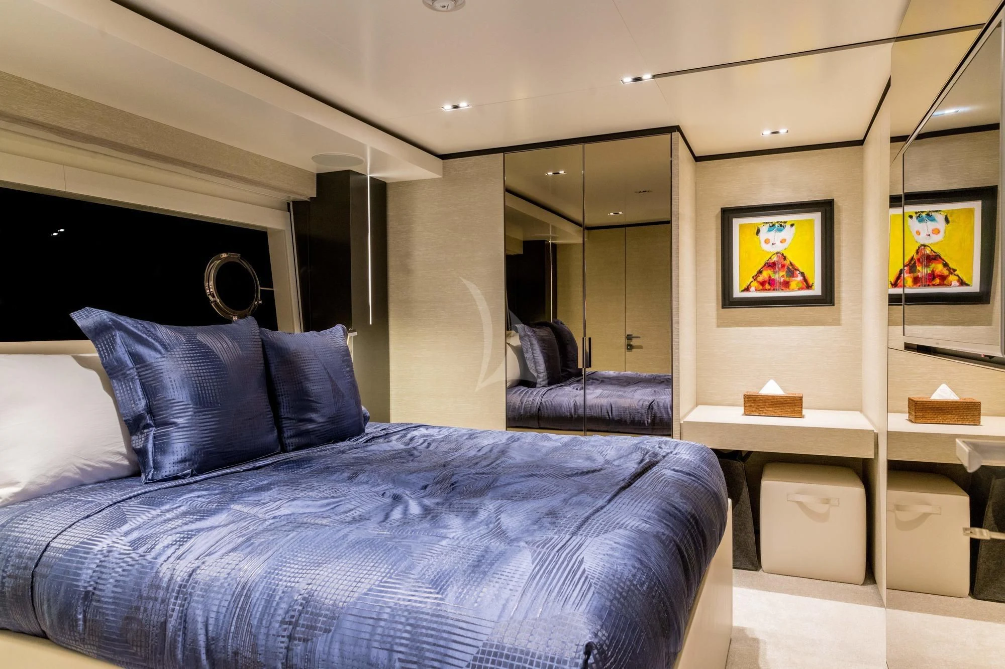 a bedroom with a bed and a desk aboard NEWAL Yacht for Sale
