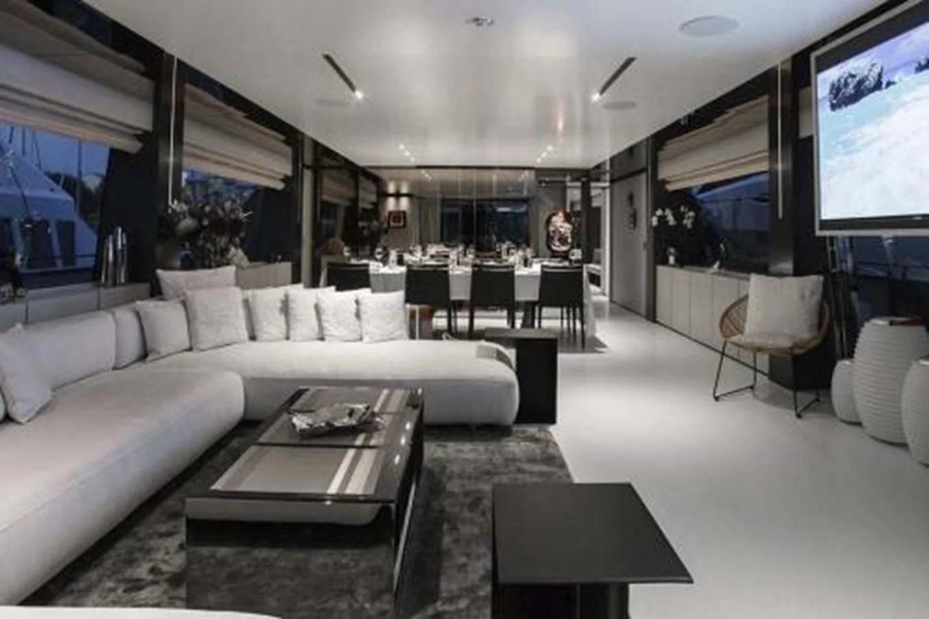a living room with a couch and a tv aboard NEWAL Yacht for Sale