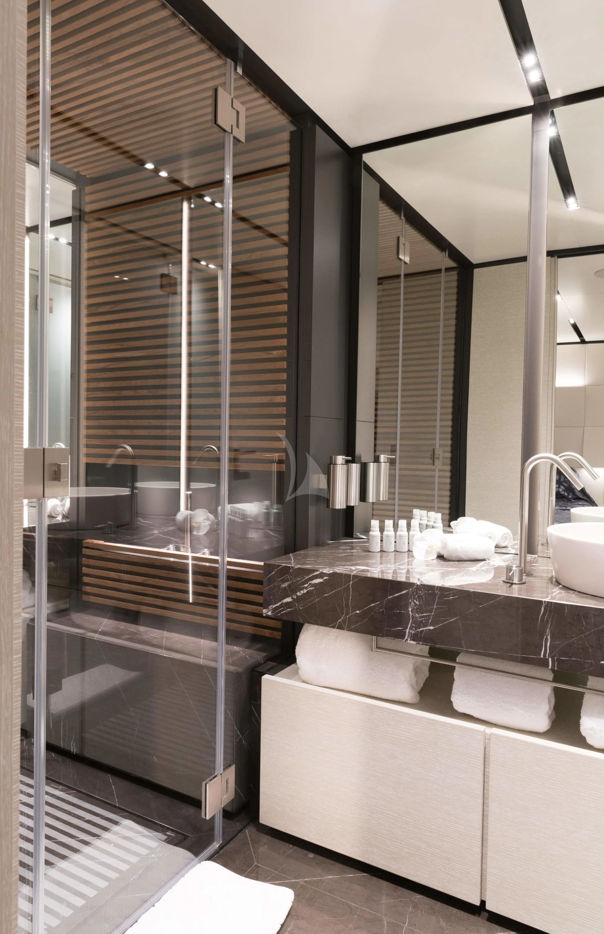 a bathroom with a large mirror aboard NEWAL Yacht for Sale