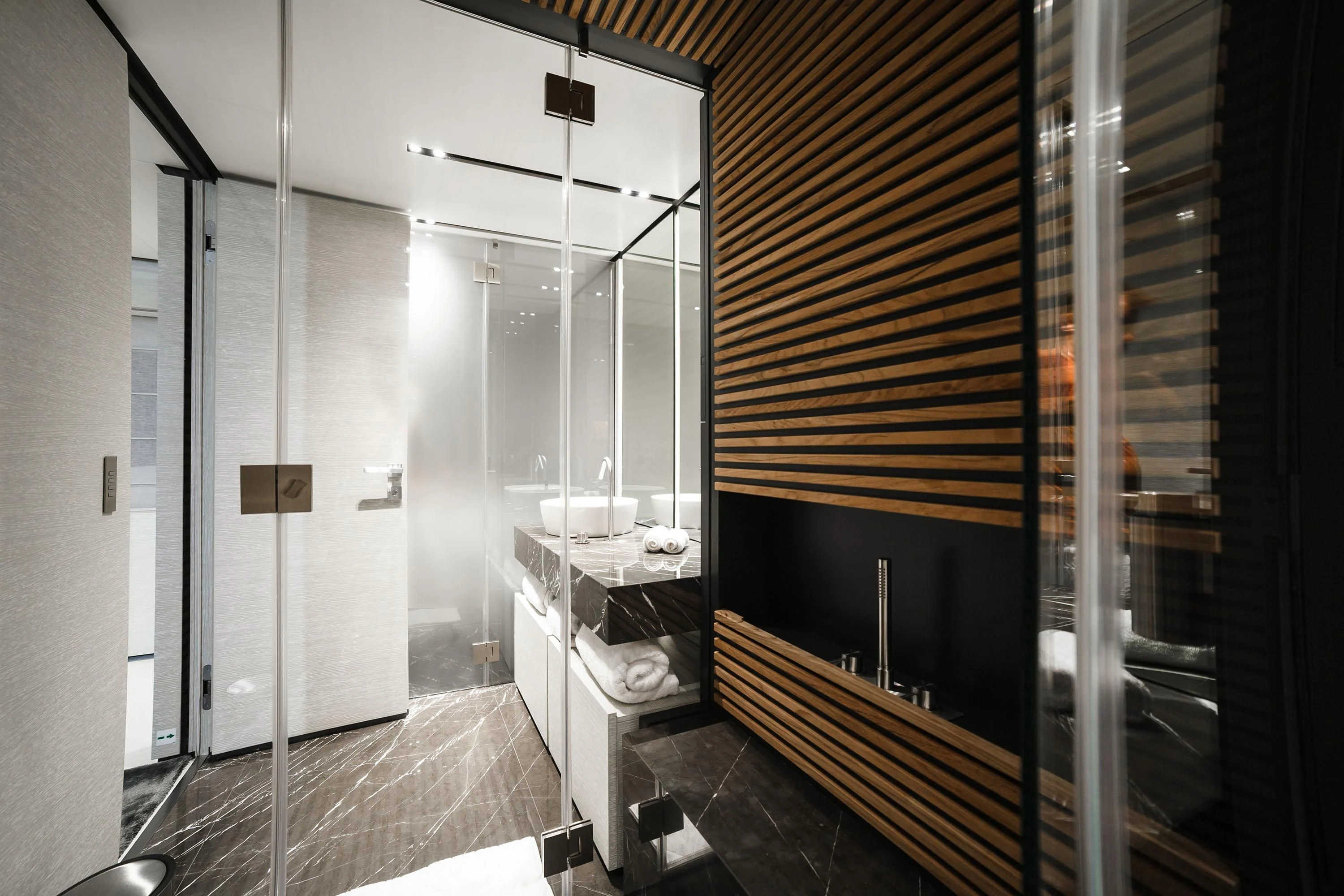 a bathroom with a large mirror aboard NEWAL Yacht for Sale