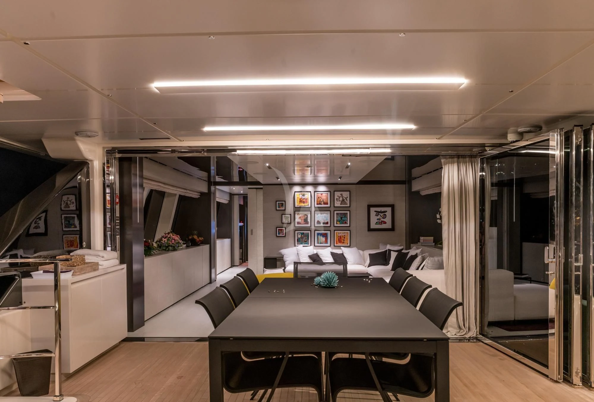 a room with a table and chairs aboard NEWAL Yacht for Sale